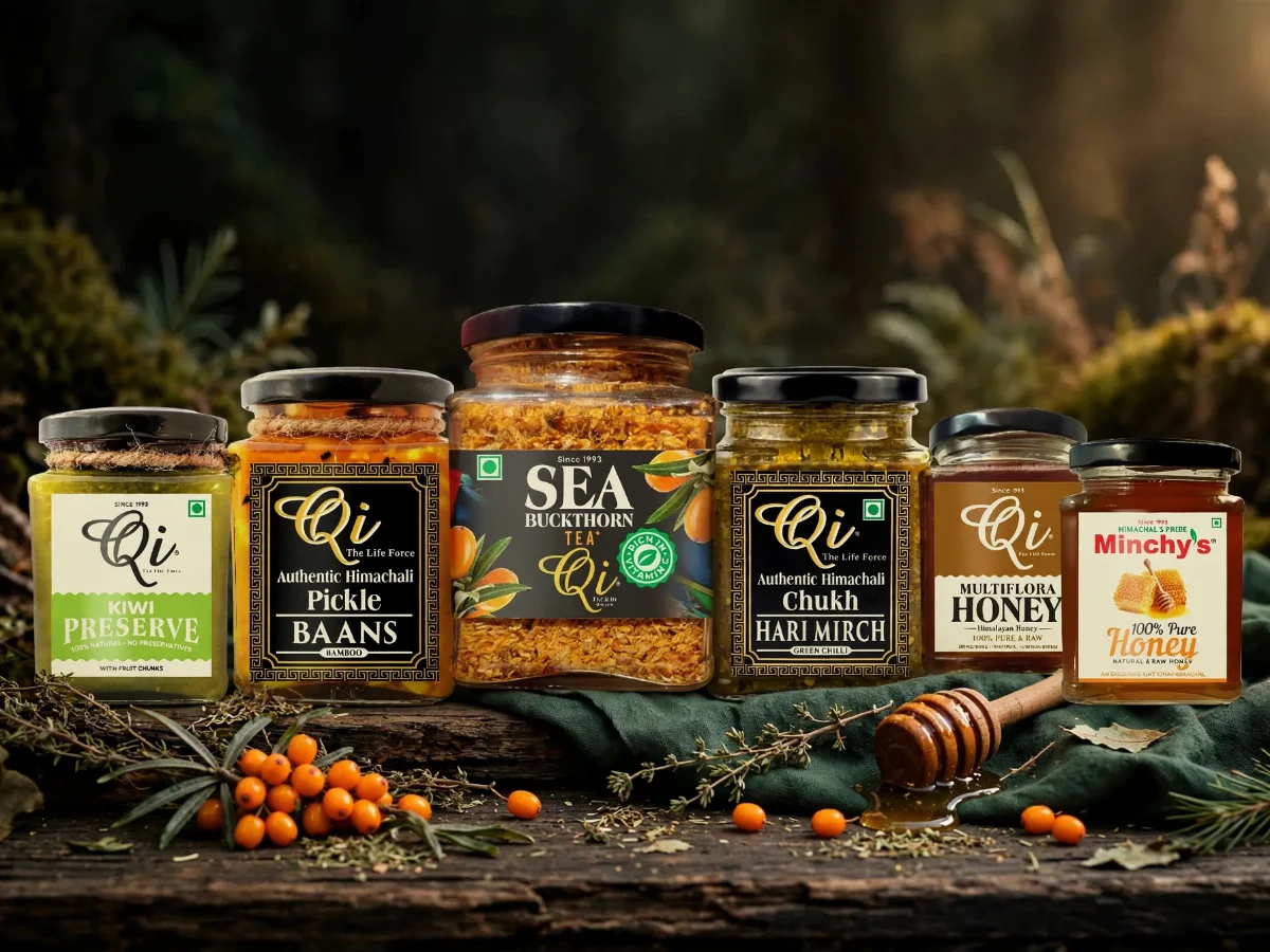 Qi kiwi preserve, baans pickle, sea buckthorn tea, hari mirch chukh and honey on dark wood